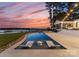 Luxury pool with patio and lounge chairs; sunset view at 111 Breezeview Pl, Mooresville, NC 28117