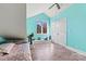 Bright bedroom with light teal walls and double doors at 111 Rapids Run Trl # 17, Iron Station, NC 28080