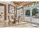 Charming breakfast nook with a glass-top table and wicker chairs near French doors at 111 Rapids Run Trl # 17, Iron Station, NC 28080