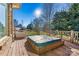 Hot tub on deck overlooking backyard and trees at 111 Rapids Run Trl # 17, Iron Station, NC 28080