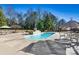 Relaxing pool with patio furniture and umbrellas at 111 Rapids Run Trl # 17, Iron Station, NC 28080