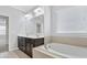 Bathroom with double vanity, soaking tub and window at 1265 Reflection Nw Ave, Concord, NC 28027