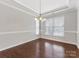 Bright dining room with hardwood floors and large window at 1265 Reflection Nw Ave, Concord, NC 28027