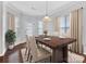 Bright dining room with hardwood floors and neutral decor at 1265 Reflection Nw Ave, Concord, NC 28027