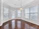 Well-lit dining area featuring hardwood floors and neutral wall colors at 1265 Reflection Nw Ave, Concord, NC 28027