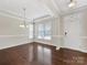 Formal dining room featuring hardwood floors and chandelier at 1265 Reflection Nw Ave, Concord, NC 28027