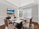 Elegant dining room with hardwood floors and chandelier at 1265 Reflection Nw Ave, Concord, NC 28027