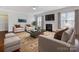 Cozy living room with fireplace, hardwood floors, and neutral furniture at 1265 Reflection Nw Ave, Concord, NC 28027