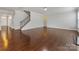 Open living room with hardwood floors and staircase at 1265 Reflection Nw Ave, Concord, NC 28027