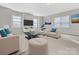 Spacious living room featuring neutral decor and ample natural light at 1265 Reflection Nw Ave, Concord, NC 28027