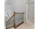 Elegant staircase with wrought iron spindles and wooden handrail at 1265 Reflection Nw Ave, Concord, NC 28027