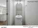 Small half bathroom with pedestal sink and light fixture at 13119 Hamilton Rd, Charlotte, NC 28273