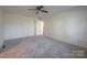 Bedroom featuring carpet, ceiling fan, and door at 1544 Daybreak Ridge Rd, Kannapolis, NC 28081