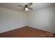 Bright bedroom with hardwood floors and ceiling fan at 1544 Daybreak Ridge Rd, Kannapolis, NC 28081