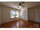 Bright bedroom with hardwood floors and ceiling fan at 1544 Daybreak Ridge Rd, Kannapolis, NC 28081