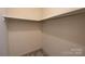 Spacious closet with built-in shelving and hanging rod at 1544 Daybreak Ridge Rd, Kannapolis, NC 28081