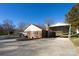 Carport and side view of brick ranch house at 1544 Daybreak Ridge Rd, Kannapolis, NC 28081