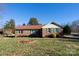 Brick ranch house with landscaped yard and driveway at 1544 Daybreak Ridge Rd, Kannapolis, NC 28081