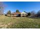 Brick ranch house with mature landscaping and a yard at 1544 Daybreak Ridge Rd, Kannapolis, NC 28081