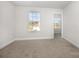 Cozy bedroom with neutral paint, carpet, and a bright window offering neighborhood views at 159 Charles Farm Dr, Cleveland, NC 27013