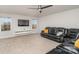 Bonus room with a sectional sofa and large TV at 159 Charles Farm Dr, Cleveland, NC 27013