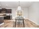 Bright dining room features a modern light fixture and a view into the kitchen at 159 Charles Farm Dr, Cleveland, NC 27013