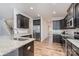 Modern kitchen with dark cabinets, granite countertops, and stainless steel appliances at 159 Charles Farm Dr, Cleveland, NC 27013