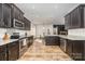 Beautiful kitchen features stainless steel appliances, granite countertops, and wood flooring at 159 Charles Farm Dr, Cleveland, NC 27013