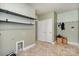 Laundry room with patterned wallpaper and shelving at 159 Charles Farm Dr, Cleveland, NC 27013