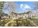 View of backyard, patio, shed and home exterior at 1814 Archdale Dr, Charlotte, NC 28210