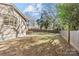 Spacious backyard with wooden fence and patio at 1814 Archdale Dr, Charlotte, NC 28210