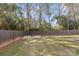 Grass backyard with firepit and wooden fence at 1814 Archdale Dr, Charlotte, NC 28210