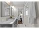 Bathroom with double vanity and view of bedroom at 1814 Archdale Dr, Charlotte, NC 28210