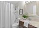 Clean bathroom with a shower/tub combo, vanity with sink, and framed mirror at 1814 Archdale Dr, Charlotte, NC 28210