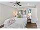 Bright bedroom with a king-size bed, wooden floors and plenty of natural light at 1814 Archdale Dr, Charlotte, NC 28210