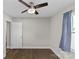 Well-lit bedroom with hardwood floors and ceiling fan at 1814 Archdale Dr, Charlotte, NC 28210