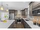 Modern kitchen with stainless steel appliances and white counters at 1814 Archdale Dr, Charlotte, NC 28210