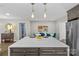 Modern kitchen island with white countertop and pendant lighting at 1814 Archdale Dr, Charlotte, NC 28210