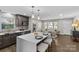 Updated kitchen flows into living area with hardwood floors at 1814 Archdale Dr, Charlotte, NC 28210