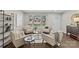 Spacious living area, featuring a sitting area and hardwood floors at 1814 Archdale Dr, Charlotte, NC 28210