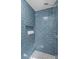 Stand-up shower with blue tile surround at 1814 Archdale Dr, Charlotte, NC 28210