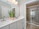 Main bathroom with double vanity and shower at 1907 Catkin Ln, Charlotte, NC 28205