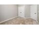 Spacious bedroom with neutral walls and carpet at 1907 Catkin Ln, Charlotte, NC 28205