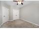 Bright bedroom with double doors and carpet at 1907 Catkin Ln, Charlotte, NC 28205