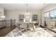 Bright dining room featuring a wooden table and access to a deck at 1907 Catkin Ln, Charlotte, NC 28205