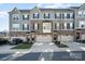 Three-story townhome with two-car garage and neutral color scheme at 1907 Catkin Ln, Charlotte, NC 28205