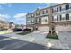 Townhome community featuring multiple units with parking at 1907 Catkin Ln, Charlotte, NC 28205