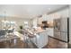 Modern kitchen with white cabinets, stainless steel appliances, and an island at 1907 Catkin Ln, Charlotte, NC 28205