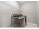 Laundry room with LG washer and dryer, and shelving at 1907 Catkin Ln, Charlotte, NC 28205