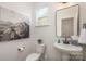 Small bathroom with pedestal sink and modern decor at 3008 Sadler Woods Ln, Charlotte, NC 28214